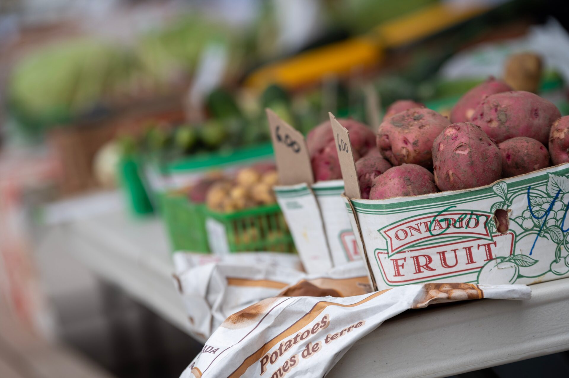 red potatoes in green and white box
